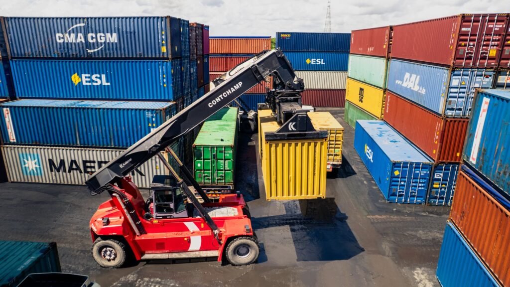 A container handler loading shipping containers at Dar es Salaam port, Tanzania