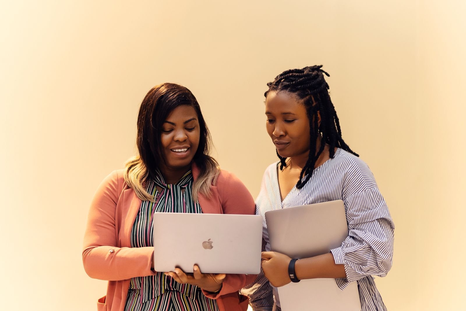 Two women working together on laptops in Lagos, Nigeria