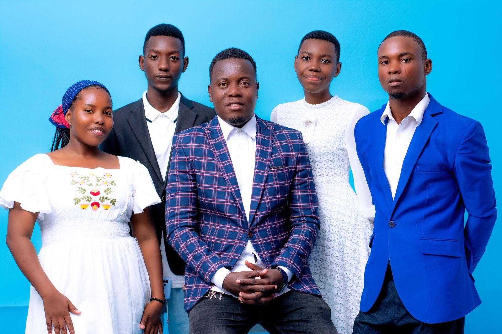 Five young Tanzanian professionals in formal clothes